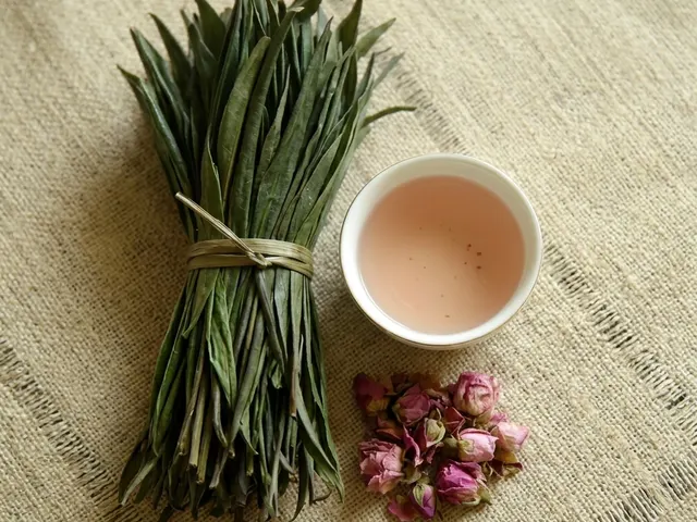 Delicate Buds Ceylon pink tea leaves with a cup of naturally pink tea, handmade in Kandy, Sri Lanka